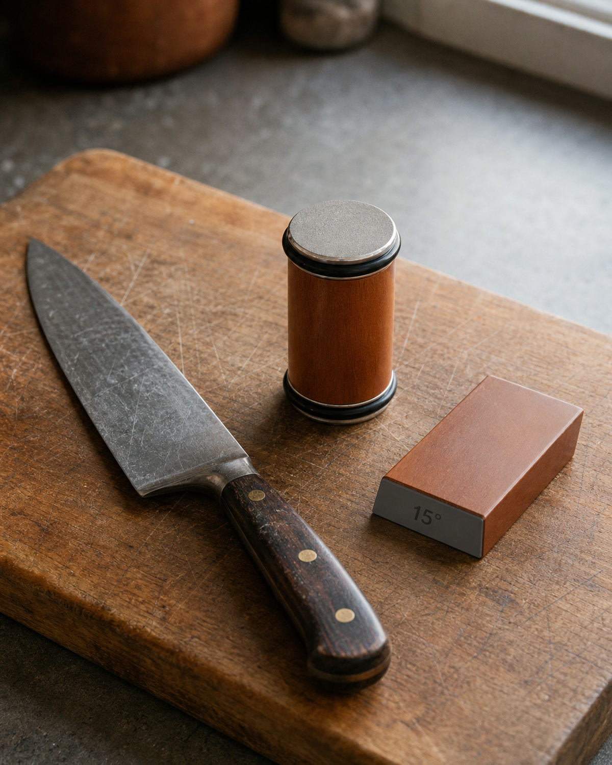 The Keldley sharpener beside a genuinely worn kitchen knife