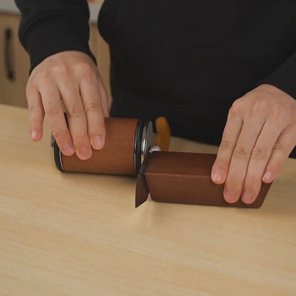 Illustrative demonstration of the Keldley rolling sharpener guided along a chef's knife edge